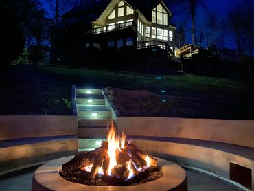 concrete fire pit with seating for 20, electrical & usb hook ups and concrete steps with lighting