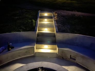 concrete steps with installed lighting features
