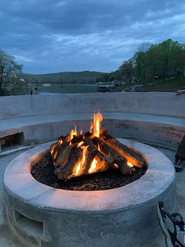 Custom concrete fire pit and seating area for 20 with electrical hook ups, USB ports and lighting