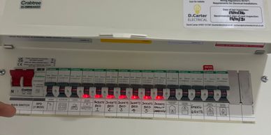 Electrical panel with several illuminated switches.