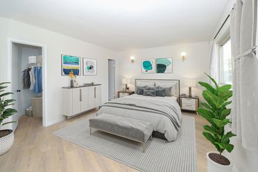 Large bedrooms with walk-in closets and Astro Lighting wall sconces.