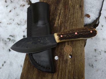 Nessmuk full custom. Peened Copper Pins, antiqued Elk stag. ML Knives Forged 1095 high carbn steel. 