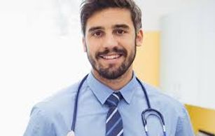 Doctor smiling and looking ahead in a professional hospital