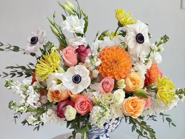 Rose flowers are placed on top of the flower pot