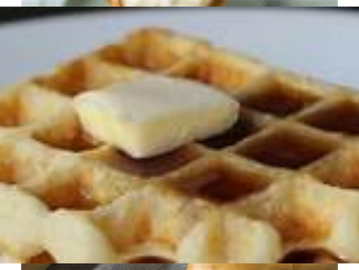 A munchie of hot waffles with syrup and butter to enjoy.