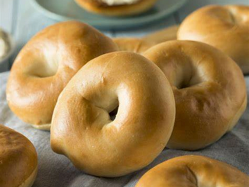 Offering bagels with Cream Cheese or smothered with butter.