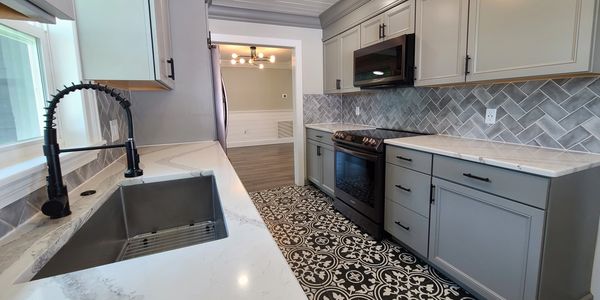 Photo of a renovated kitchen in a Relentless residential property.