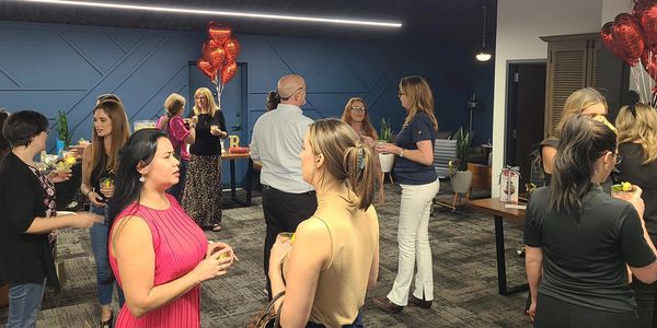 Photo of Relentless cocktail party with people talking and making connections.