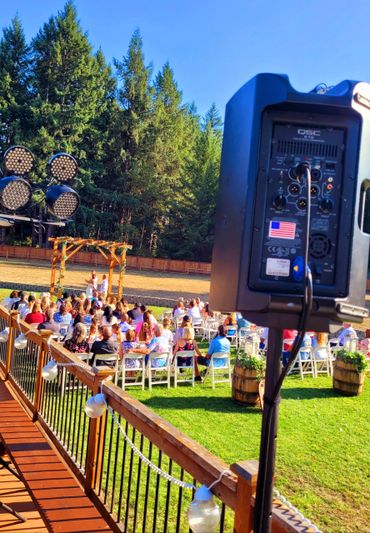 Seattle DJ with a speaker in the sun.
