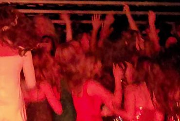 Crowd dancing to NW Wedding DJs music.