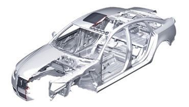 Silver car frame chassis without exterior panels or interior parts.