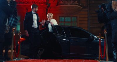 Guests in black tie arriving by chauffeured car at a red carpet gala, Palm Springs Film Awards night