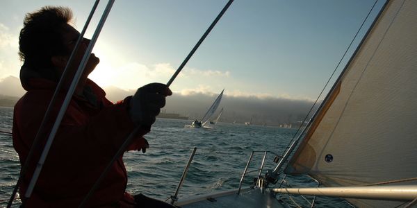 silhouette of man sailing