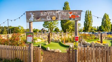 Entrance to an outdoor adventure golf course with animal illustrations. Stonebridge Adventure Golf course near Birmingham West Midlands