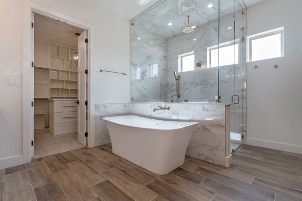 Master bathroom with steam shower, pedestal tub and walk in closet