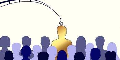 A fishing hook targeting a golden person among a crowd of blue silhouettes.