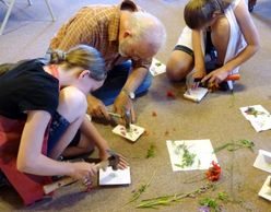 Family creating Nature and Art Journey "book" covers after their hike together at Colwell Cedars.