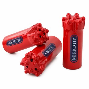 Red Mikrotip drill bits with multiple cutting edges.