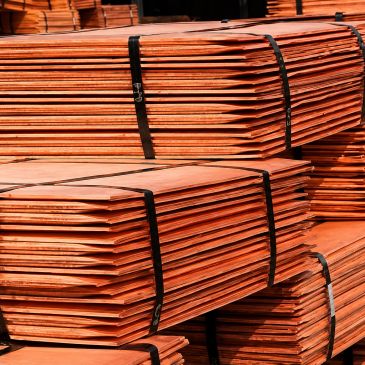 Stacks of bundled copper sheets.
