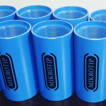 Blue cylindrical containers with threading and 'MIKROTIP' label.