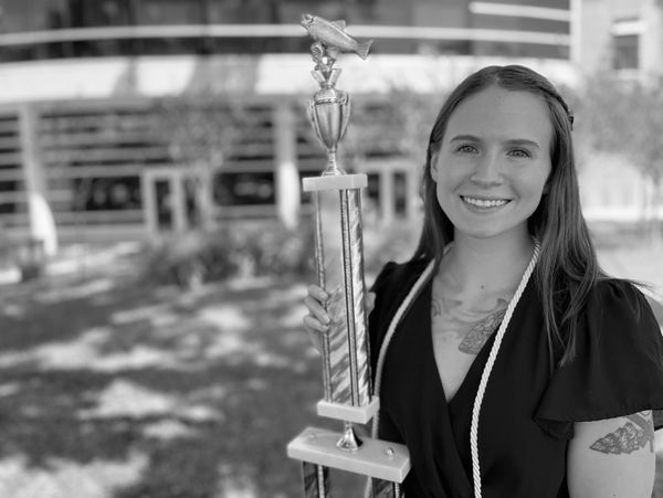Sarah with her Fine Arts Academic Achievement Award.