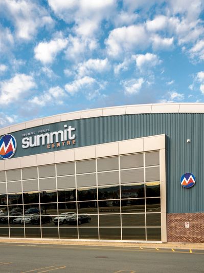 Exterior view of Mount Pearl Summit Centre under a partly cloudy sky.