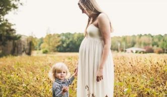 a mom with her little boy in the park looking for a babysitter