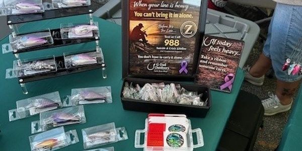 A table displays fishing lures and suicide prevention information.