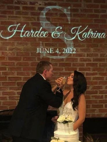 You can see one of our custom monograms displayed as the bride and groom do their toast.
