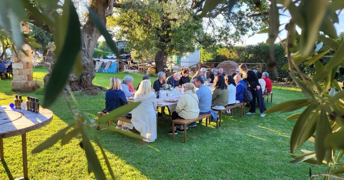 Group dining outdoors with $100 discount for 2027 tours.
