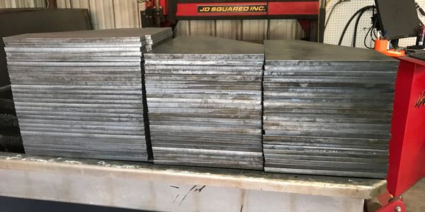 cnc plasma cut steel on cnc plasma table in welding shop