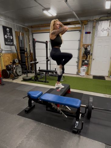 Woman exercising on a bench in a home gym.
