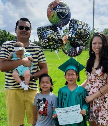 Family children graduation District 9 elementary