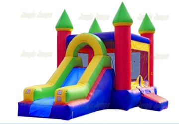 Colorful inflatable bounce house with slide and towers.