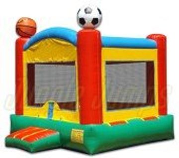Colorful inflatable bounce house with sports ball decorations on top.