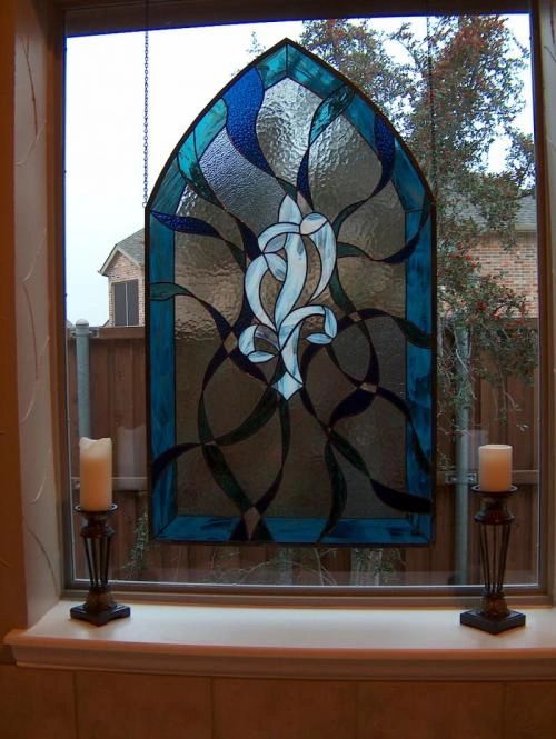 Arnold Arch hanging stained glass piece for bathroom.