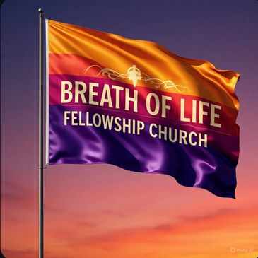 A colorful flag of Breath of Life Fellowship Church waving against a sunset sky.