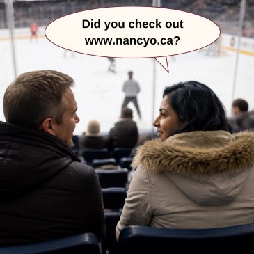 Couple at hockey game talking.