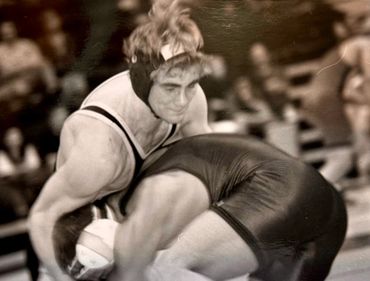 two men are playing wrestling