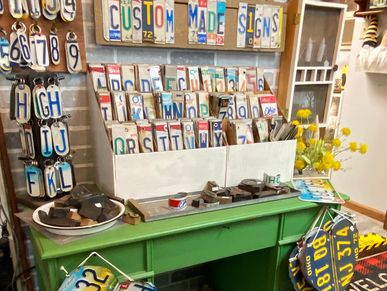 Tattered & Worn custom license plate signs