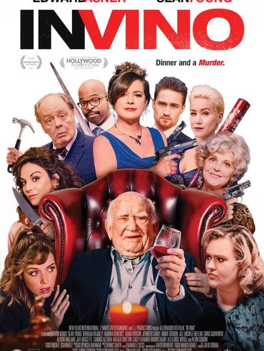 A group of people with weapons surrounding an elderly man holding a wine glass in a red chair.