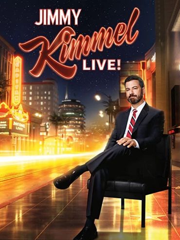 Jimmy Kimmel sitting on a chair with city lights and a starry sky background.