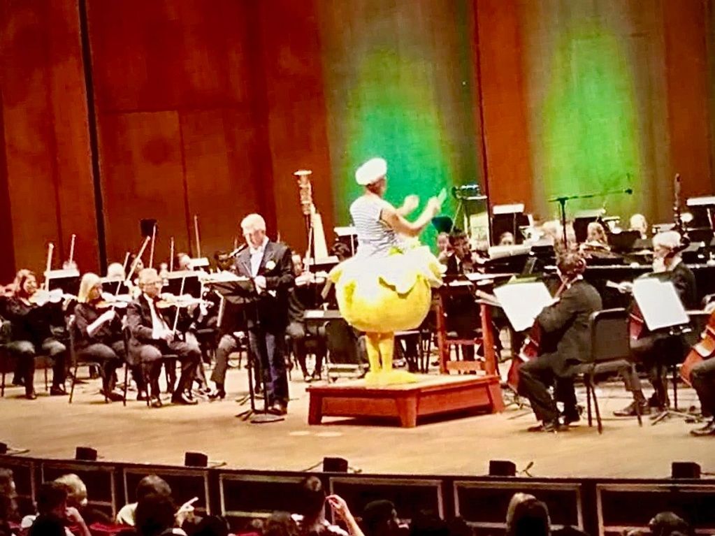 St.John Flynn on stage with the Houston Symphony and conductor Robert Franz