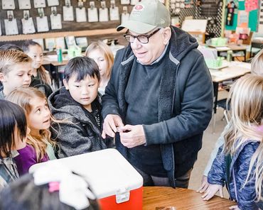 One of our members  speaking to kids about the trout in the classroom project