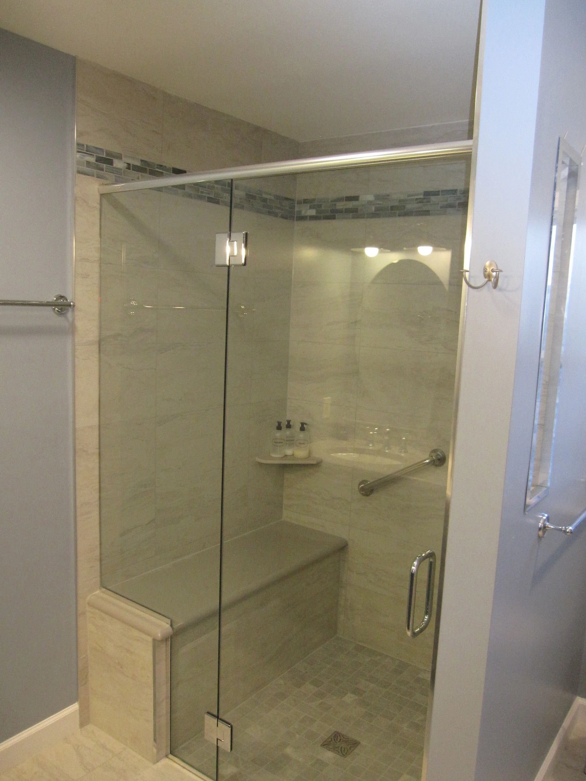 #curb less shower, #shower bench, #laticrete spectra lock grout, glass feature strip, #heated floor 