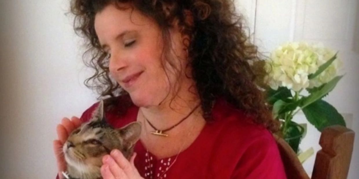 Reiki Master Alexandra Savithri gives Reiki healing to Chicu the cat