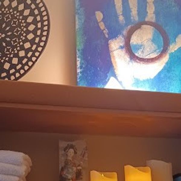 Healing hands painting and mandala sculpture art at Natural Massotherapy in Cleveland, Ohio.
