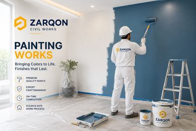 Professional painter painting a wall blue with Zarqon Civil Works branding.