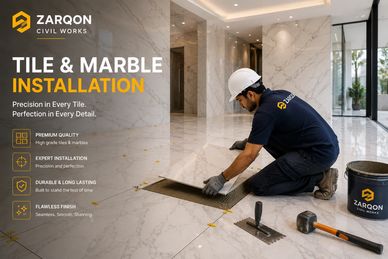 Worker installing marble tiles for Zarqon Civil Works.