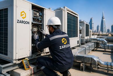 Technician repairing air conditioning unit on rooftop.